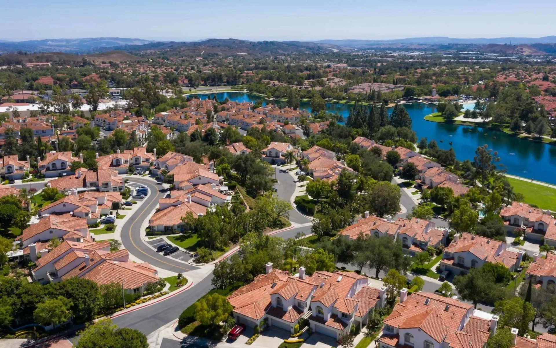 Rancho Santa Margarita two-story family home with upstairs laundry closet and stacked washer dryer pair