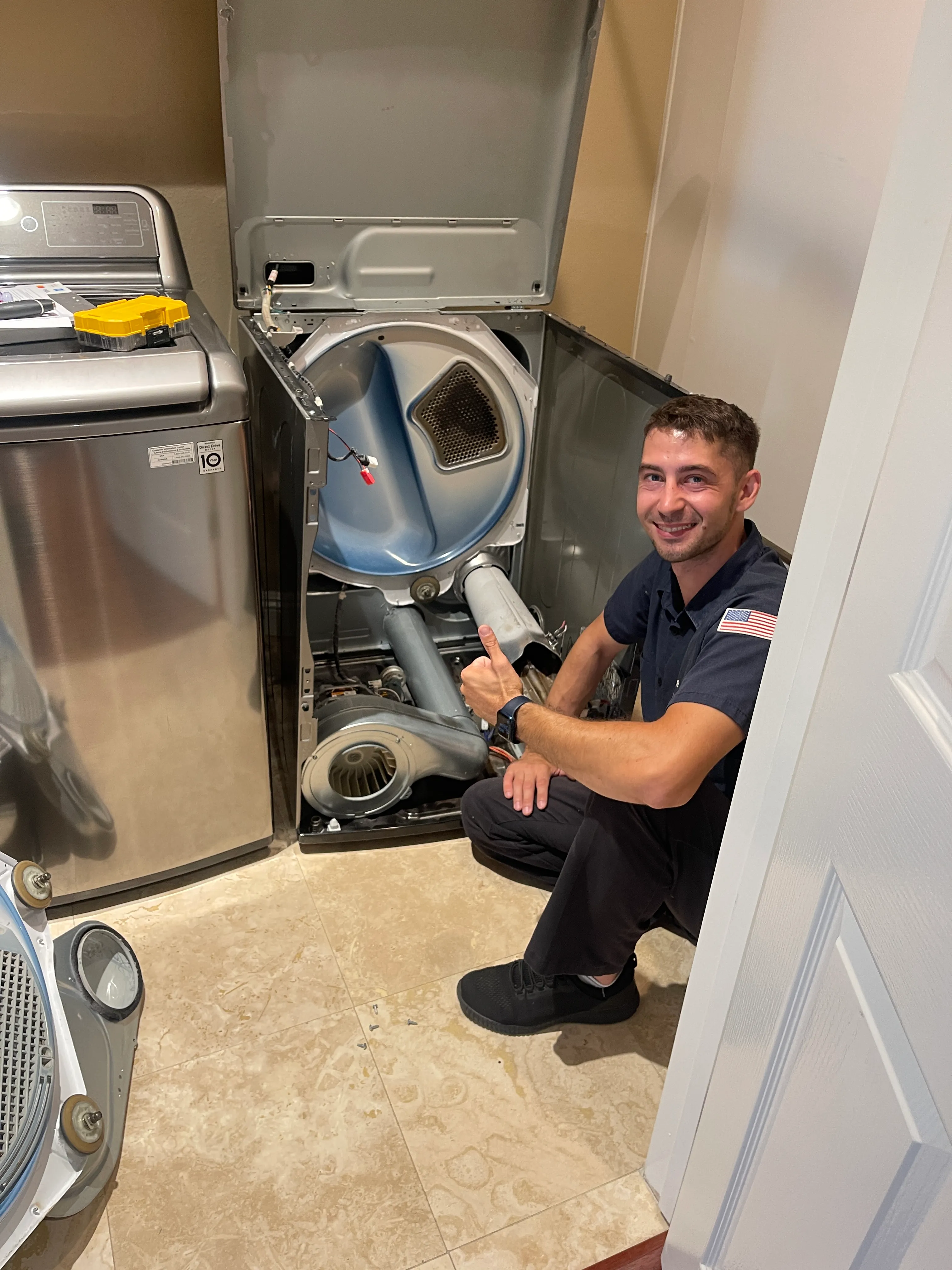 We Fix Dryer technician diagnosing an open dryer in an Orange County laundry room